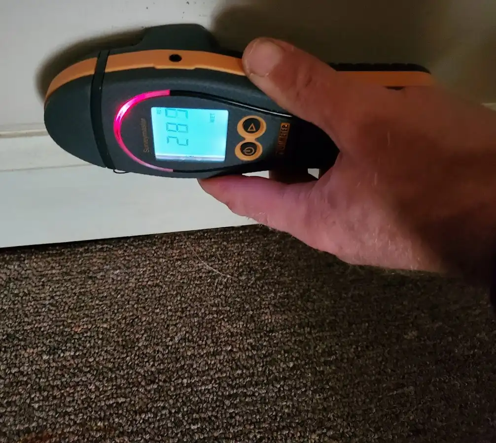 Moisture detection at baseboard during Storm Damage Restoration in Dighton